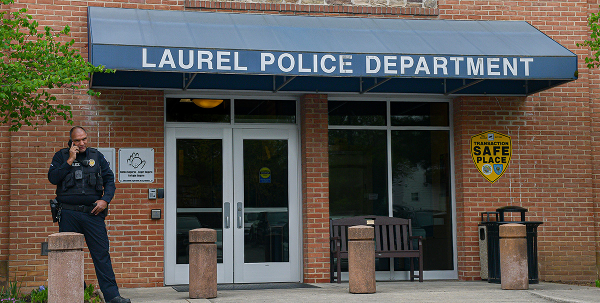 Officer Edwin Monarrez with the Laurel Police Department helps patrol the Laurel Lakes Shopping Centre, waiting for calls from security guards. (Alisha Camacho/CNS)

