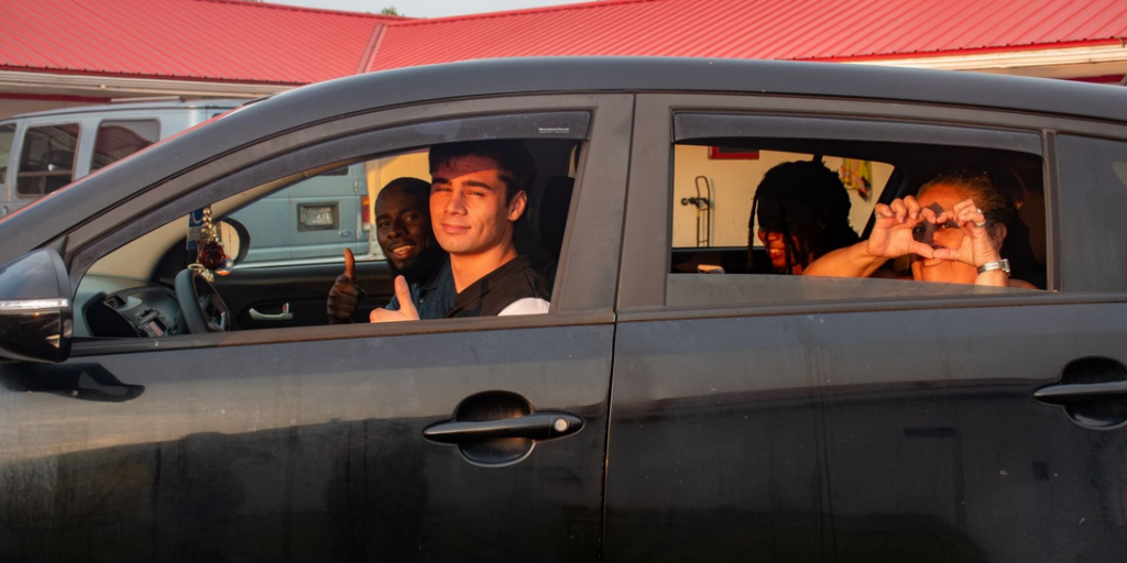 Image of RESPIRAR research assistants in a car departing a motel after a long field day in Maryland's Eastern Shore.